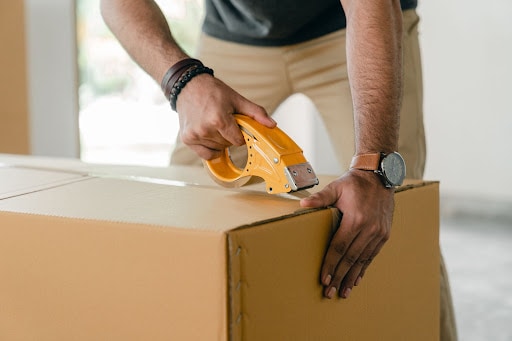 Man Packing A Box